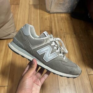New balance 574s in a greyish color. Size 11